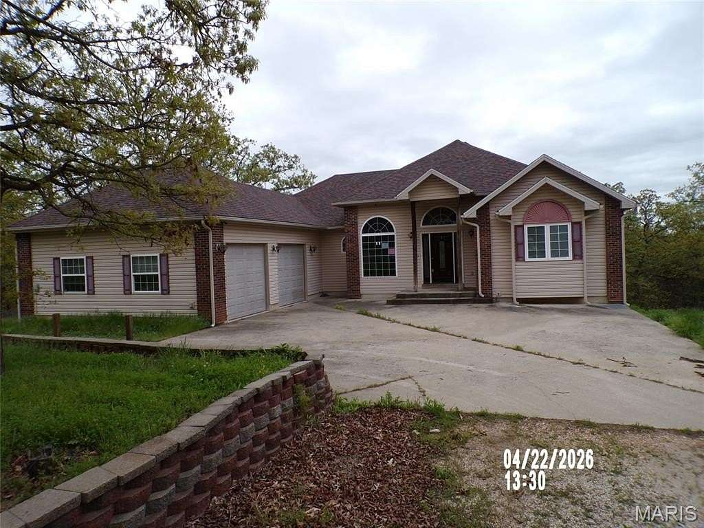 9.4 Acres of Land with Home for Sale in Brumley, Missouri
