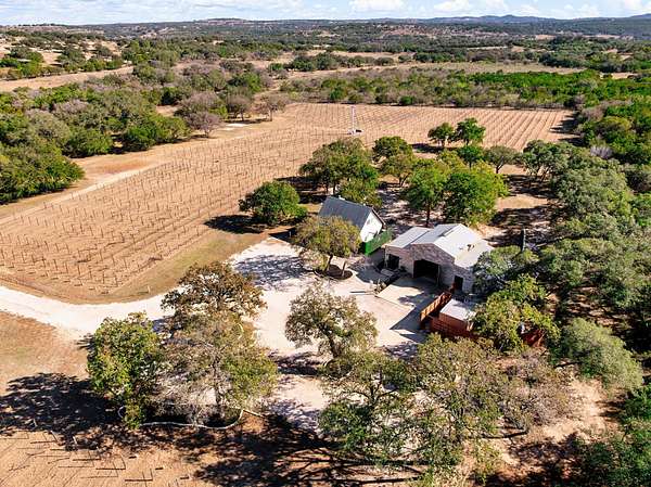 46.5 Acres of Agricultural Land with Home for Sale in Round Mountain, Texas