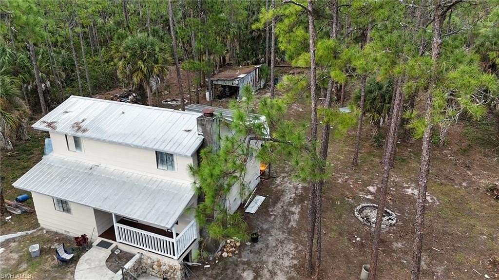 2.27 Acres of Residential Land with Home for Sale in Naples, Florida