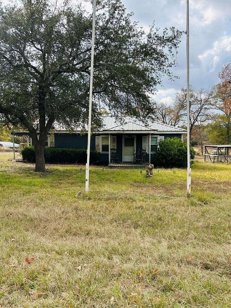 7.8 Acres of Residential Land with Home for Sale in Elkhart, Texas