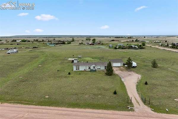 5 Acres of Residential Land with Home for Sale in Peyton, Colorado