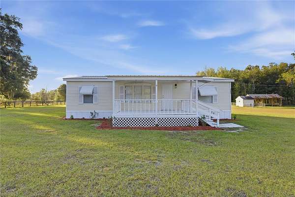 4 Acres of Residential Land with Home for Sale in Citra, Florida