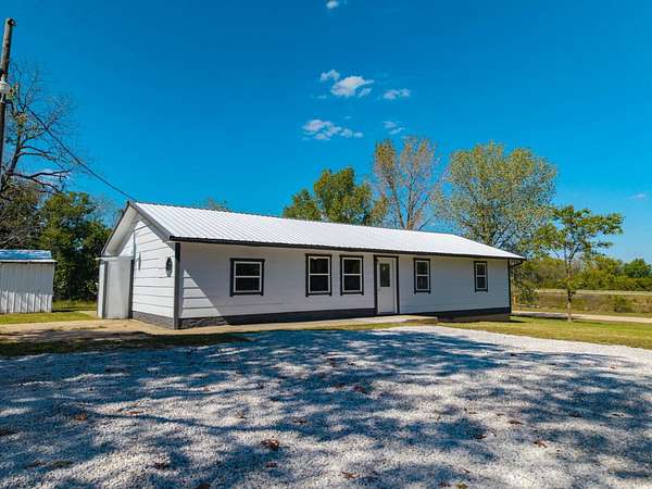 5.78 Acres of Land with Home for Sale in Norwood, Missouri