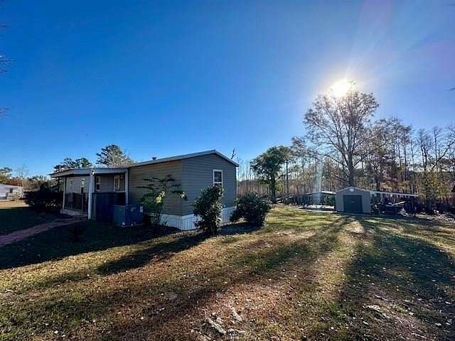 3.67 Acres of Residential Land with Home for Sale in Wewahitchka, Florida