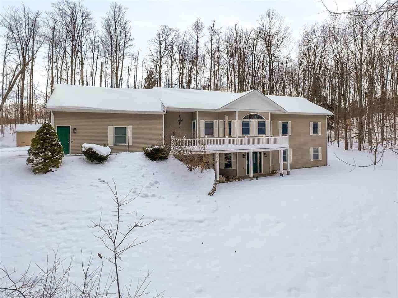 7.69 Acres of Residential Land with Home for Sale in Petoskey, Michigan