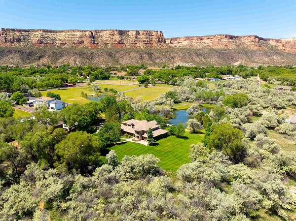 7.1 Acres of Residential Land with Home for Sale in Grand Junction, Colorado