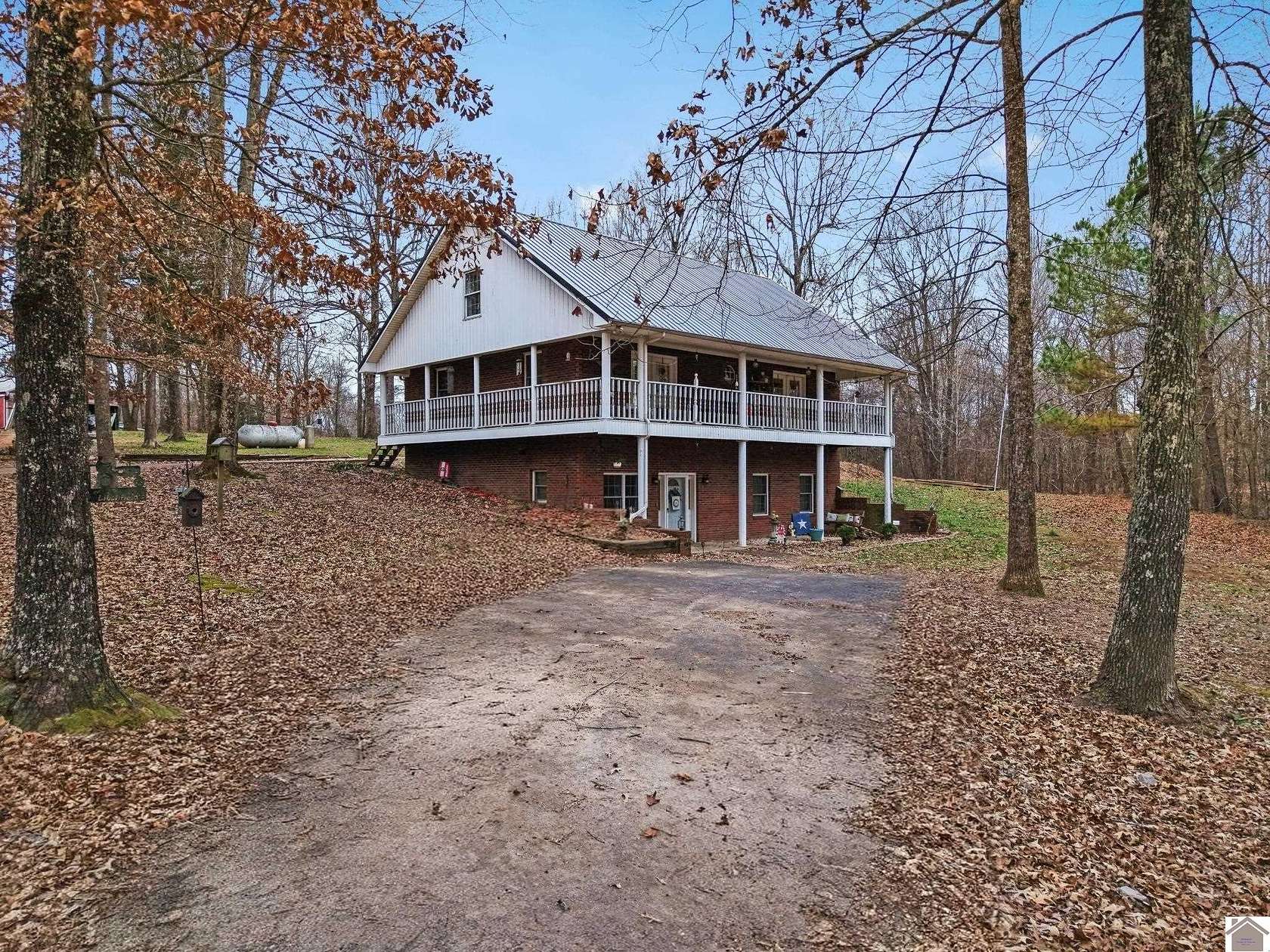 15.6 Acres of Land with Home for Sale in Benton, Kentucky