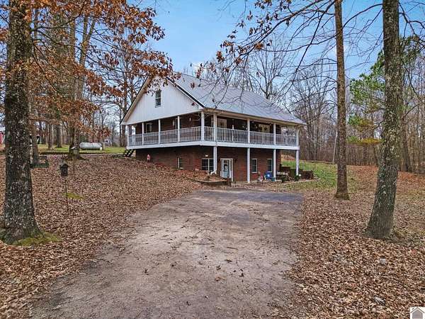 15.6 Acres of Land with Home for Sale in Benton, Kentucky