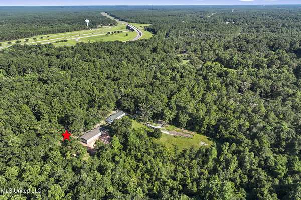 4.5 Acres of Residential Land with Home for Sale in Saucier, Mississippi