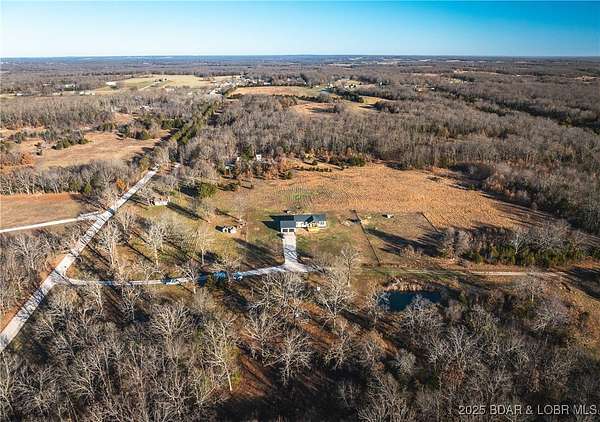 75.3 Acres of Land with Home for Sale in Lebanon, Missouri