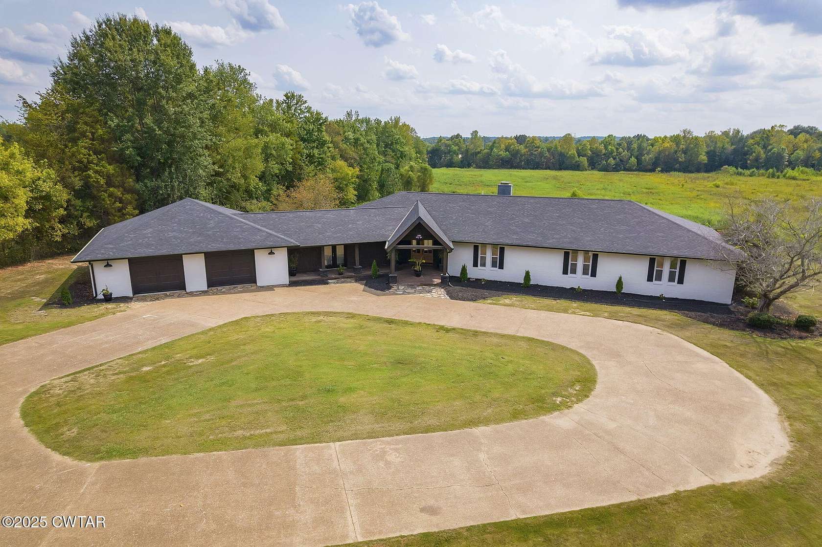 10.9 Acres of Land with Home for Auction in Jackson, Tennessee