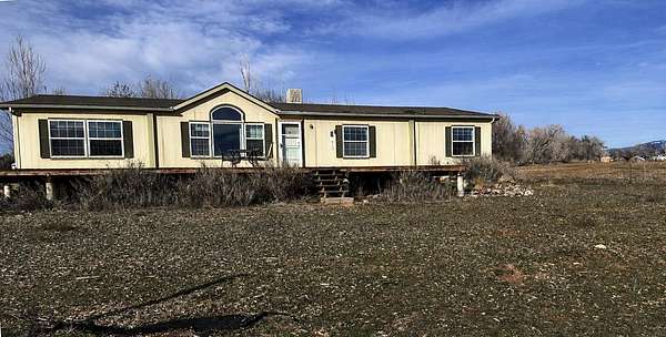 11.7 Acres of Land with Home for Sale in Hotchkiss, Colorado