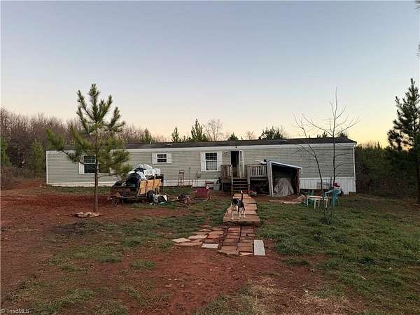 10.5 Acres of Land with Home for Sale in Hamptonville, North Carolina