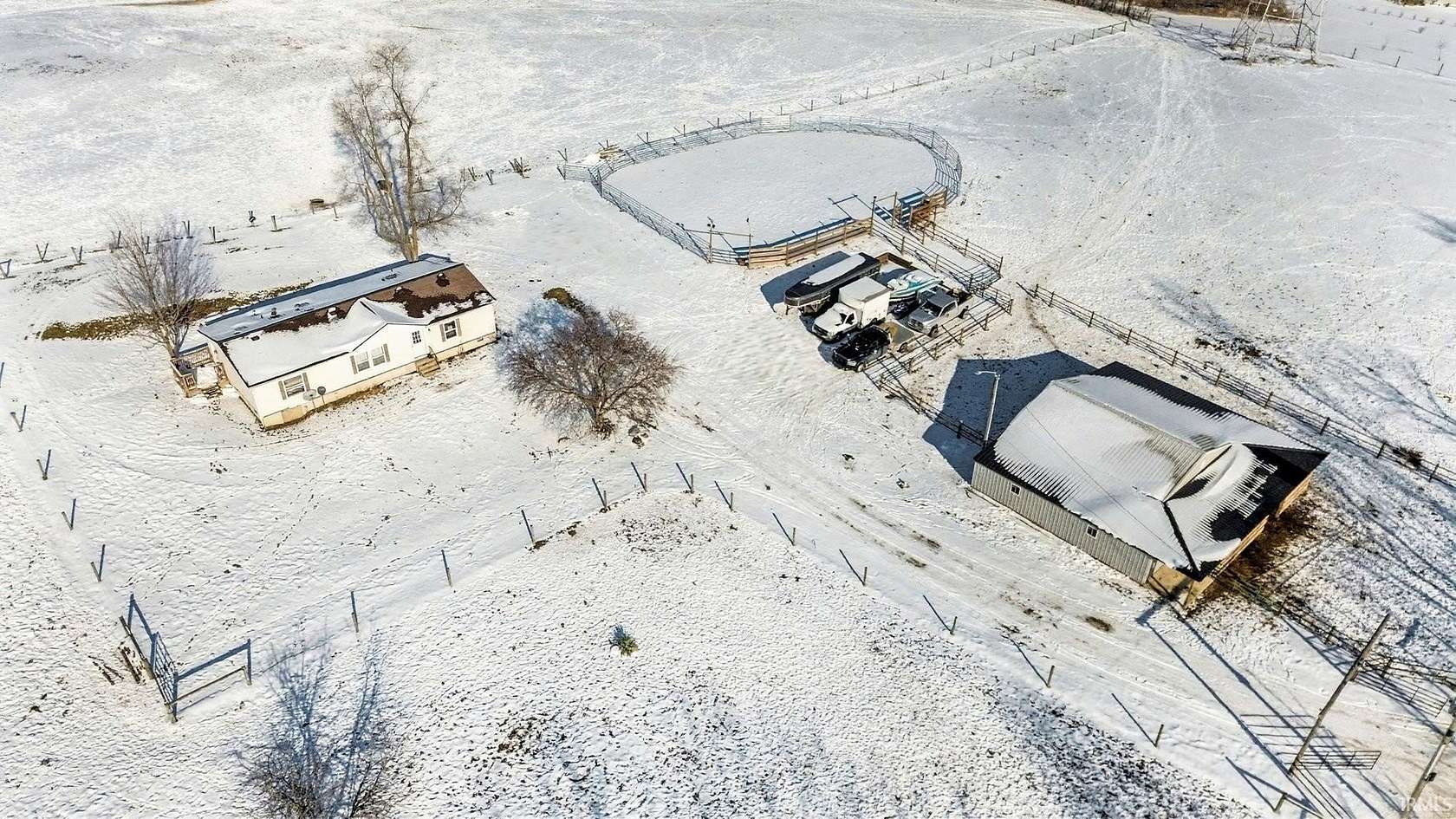 10 Acres of Land with Home for Auction in Syracuse, Indiana