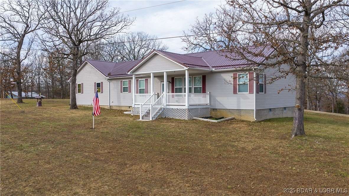 3.69 Acres of Residential Land with Home for Sale in Gravois Mills, Missouri