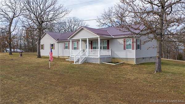 3.69 Acres of Residential Land with Home for Sale in Gravois Mills, Missouri