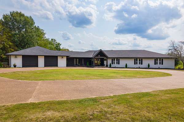 10.4 Acres of Land with Home for Auction in Jackson, Tennessee