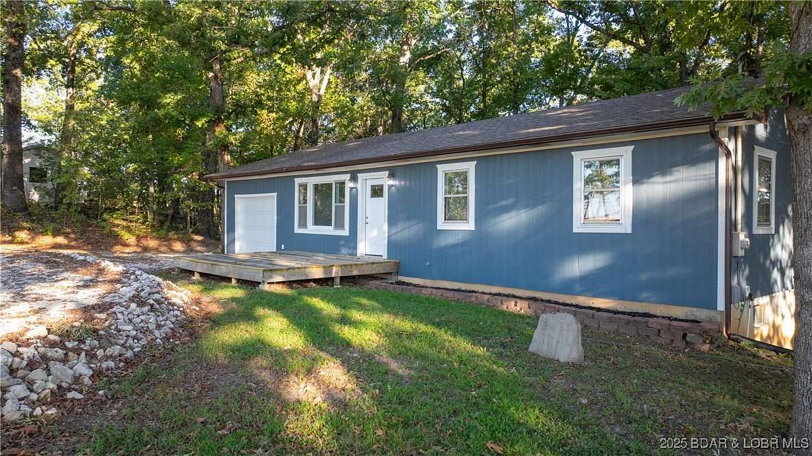 1.55 Acres of Residential Land with Home for Sale in Lake Ozark, Missouri