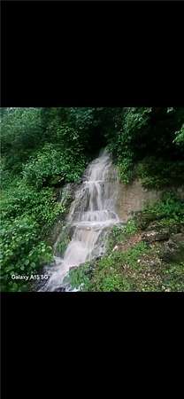4.78 Acres of Land with Home for Sale in Garfield, Arkansas
