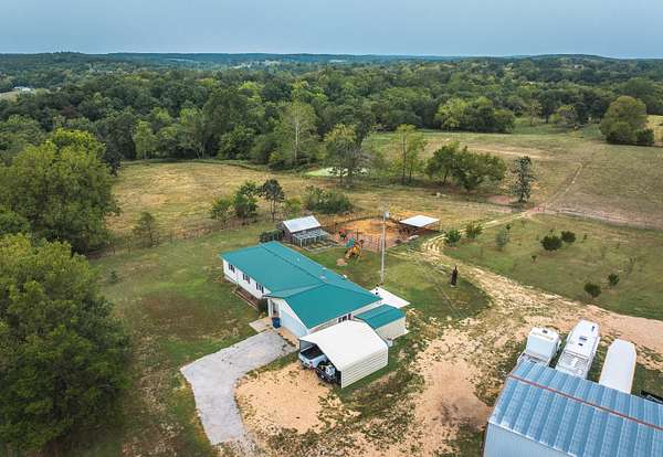 25 Acres of Land with Home for Sale in Lebanon, Missouri