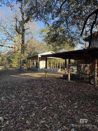 12.2 Acres of Recreational Land with Home for Sale in Evergreen, Alabama