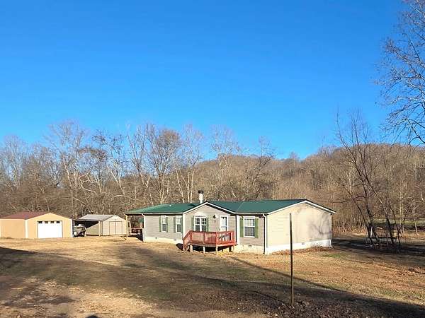 6.82 Acres of Residential Land with Home for Sale in Cumberland City, Tennessee