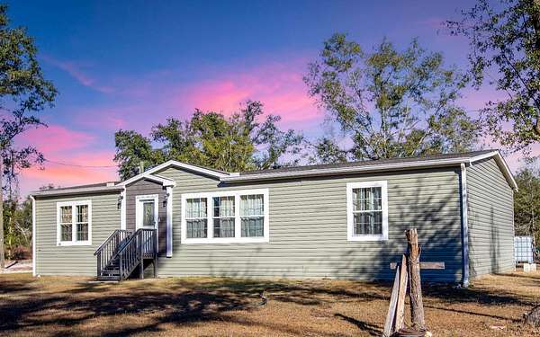 4 Acres of Residential Land with Home for Sale in Lee, Florida