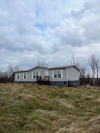 73.5 Acres of Land with Home for Sale in Reedsville, Ohio