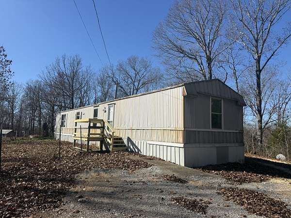 1.9 Acres of Residential Land with Home for Sale in Linden, Tennessee