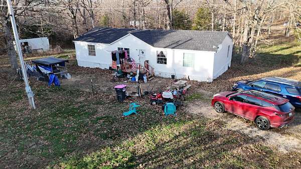 22 Acres of Land with Home for Sale in Grovespring, Missouri