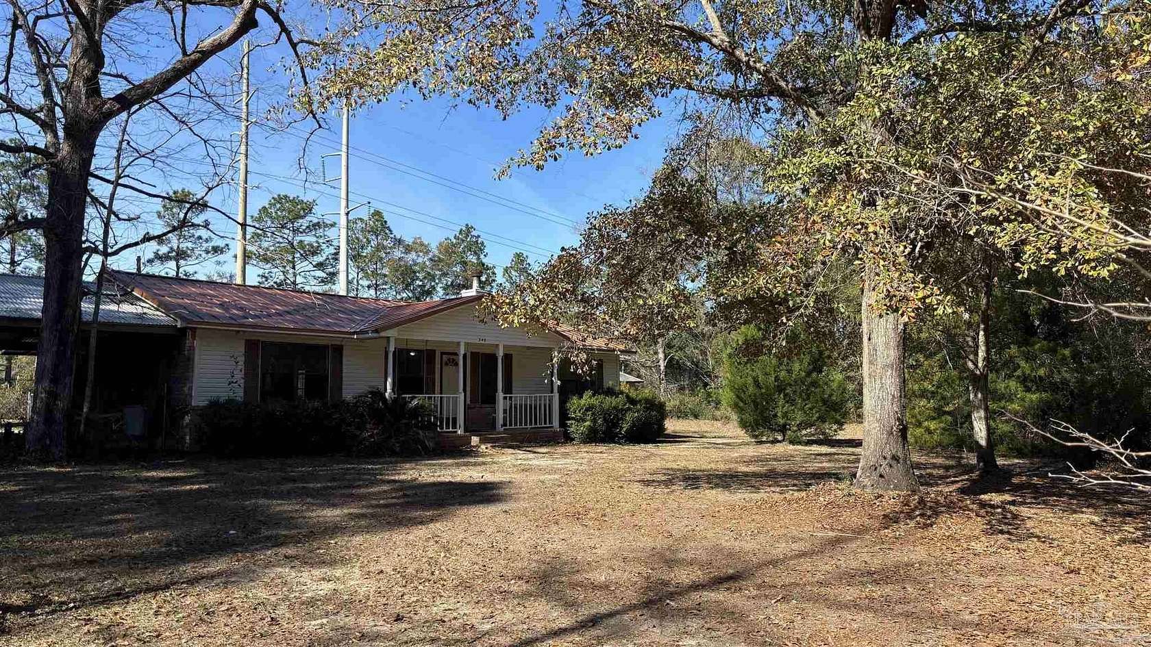 5.87 Acres of Residential Land with Home for Sale in McDavid, Florida