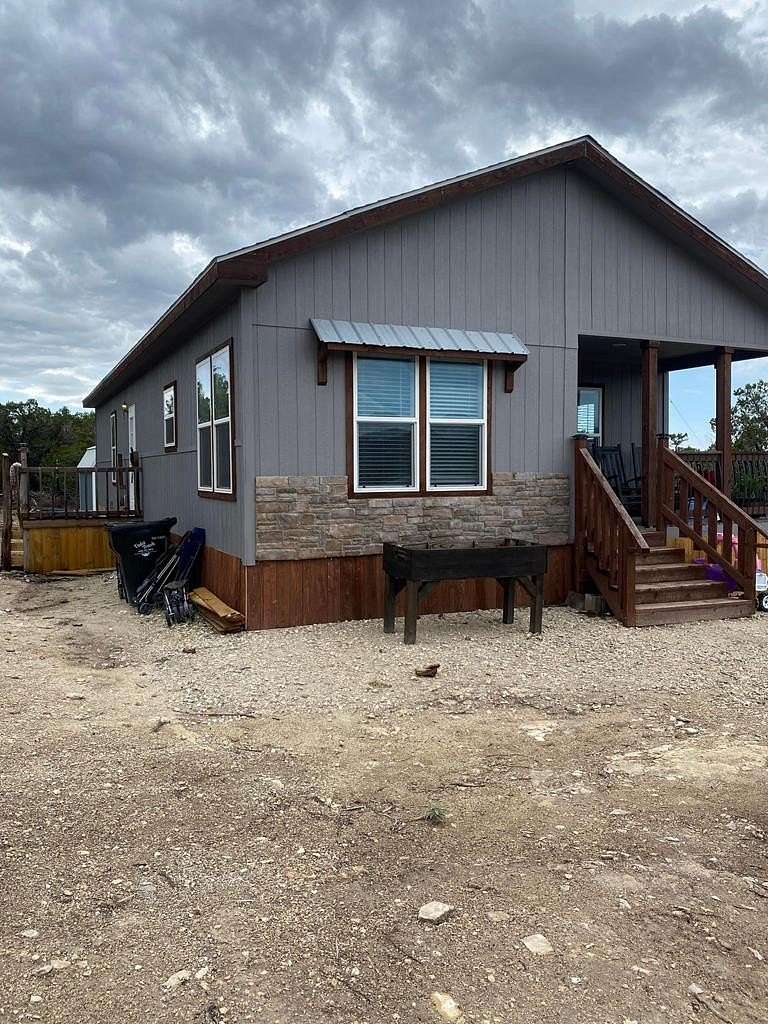 10 Acres of Residential Land with Home for Lease in Center Point, Texas