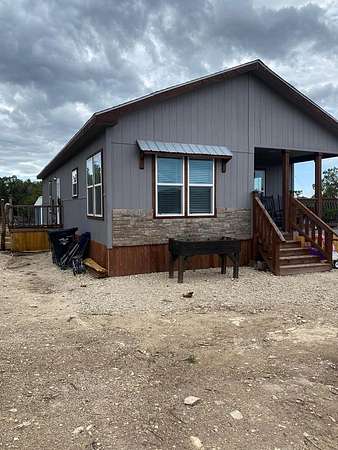 10 Acres of Residential Land with Home for Lease in Center Point, Texas