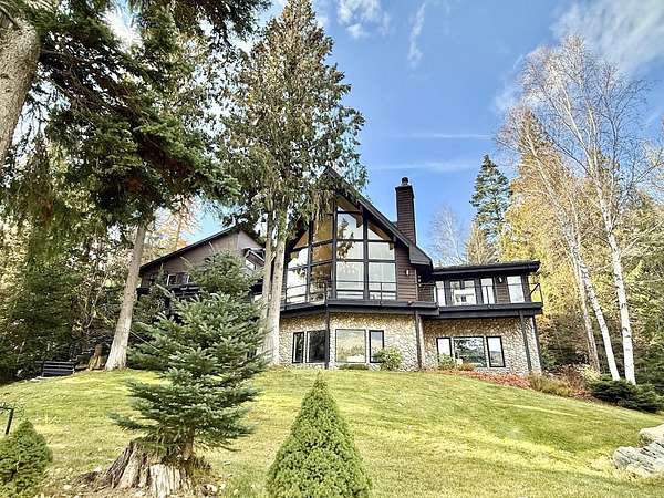 4.9 Acres of Residential Land with Home for Sale in Bigfork, Montana