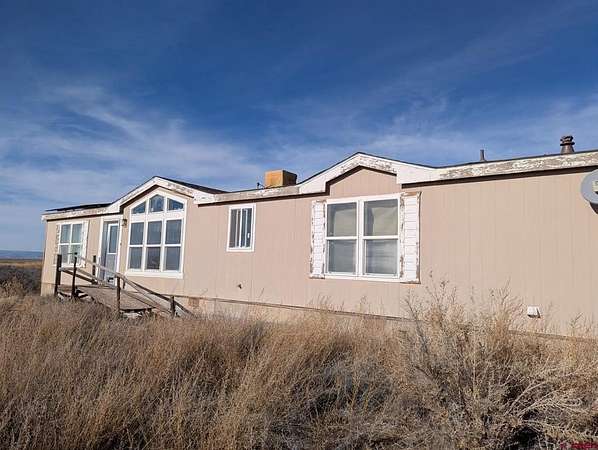 20.9 Acres of Agricultural Land with Home for Sale in Delta, Colorado