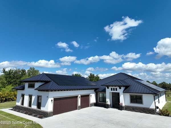 2.65 Acres of Residential Land with Home for Sale in Palm Bay, Florida