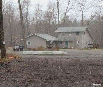10.5 Acres of Land with Home for Auction in Otter Lake, Michigan