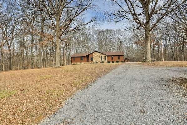 4.12 Acres of Residential Land with Home for Sale in Chapmansboro, Tennessee