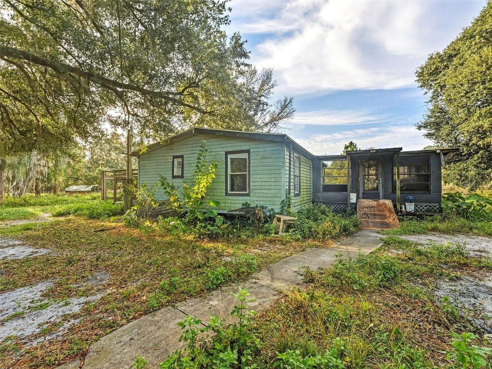 5 Acres of Residential Land with Home for Sale in Polk City, Florida