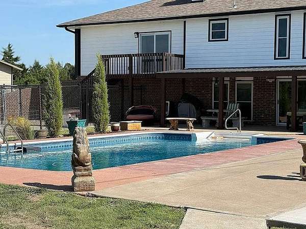 1.6 Acres of Residential Land with Home for Sale in Russell, Kansas