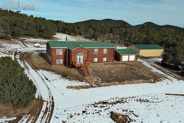 5.3 Acres of Residential Land with Home for Sale in Cotopaxi, Colorado