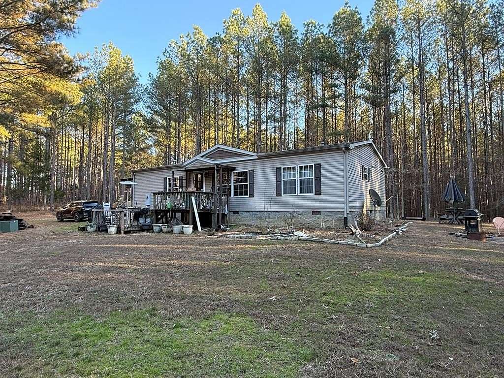 15.1 Acres of Recreational Land with Home for Sale in Camden, Tennessee