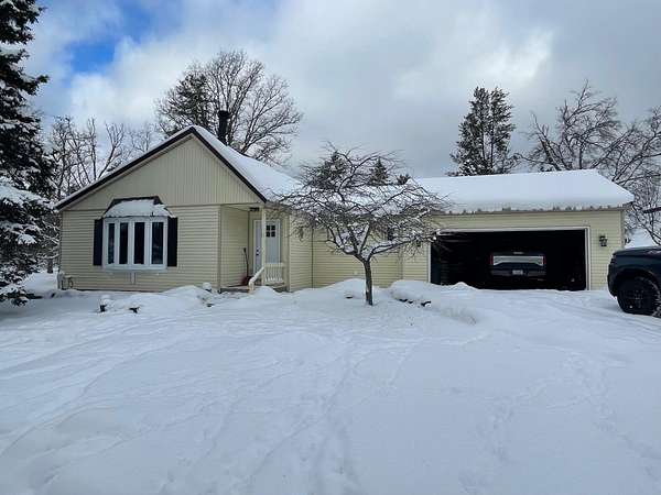 10 Acres of Recreational Land with Home for Sale in Irons, Michigan