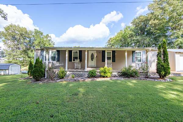 5.38 Acres of Residential Land with Home for Sale in Clifton, Tennessee