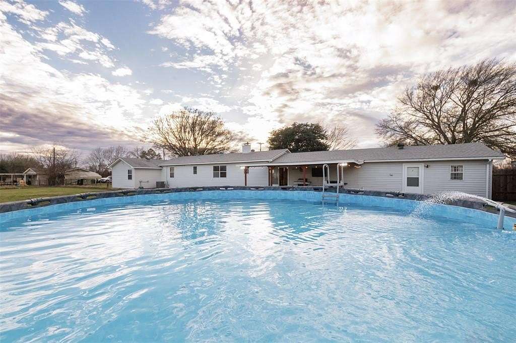 1.69 Acres of Land with Home for Sale in Quinlan, Texas