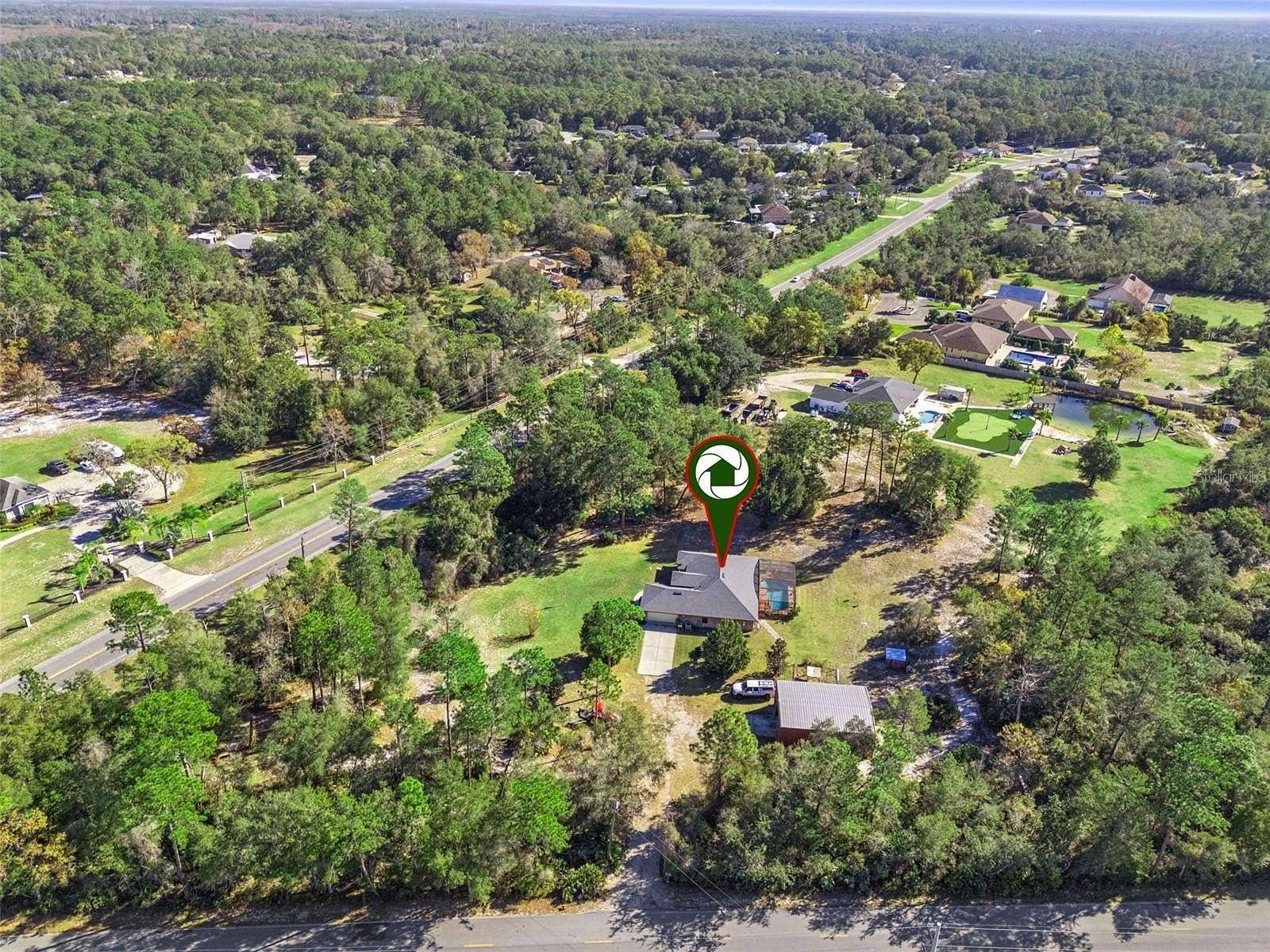 2.62 Acres of Land with Home for Sale in Deltona, Florida