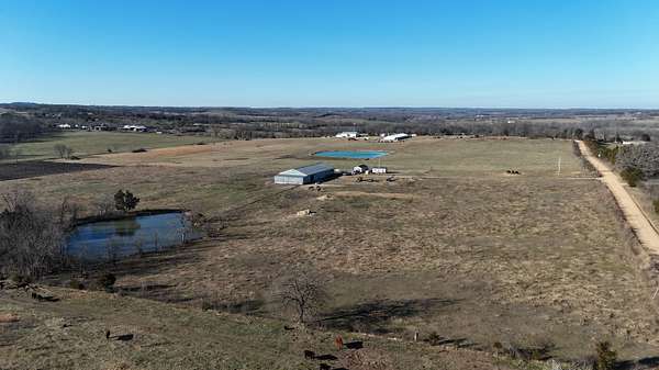 14.9 Acres of Land with Home for Sale in Mansfield, Missouri