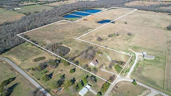 29.8 Acres of Agricultural Land with Home for Sale in Wolfe City, Texas