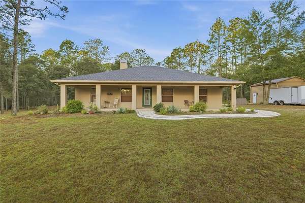 4.84 Acres of Residential Land with Home for Sale in Floral City, Florida