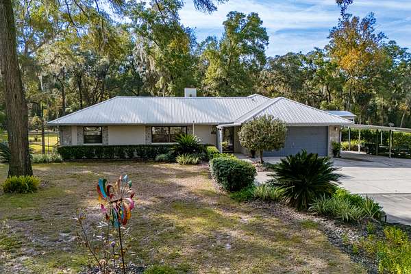 10.3 Acres of Recreational Land with Home for Sale in Chiefland, Florida